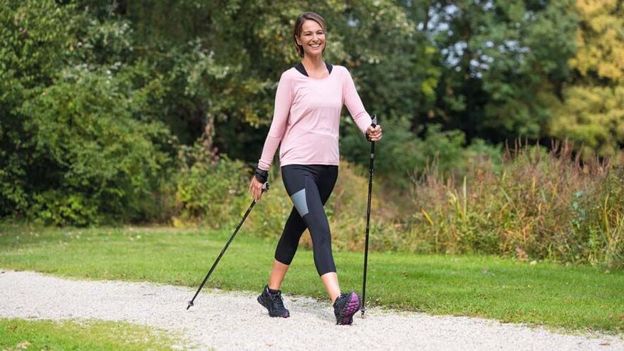 a busy woman walks to prevent back pain