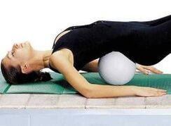 Exercise with a roller under the lower back